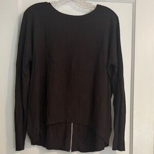 Dark gray, almost black, sweater with zipper detail back